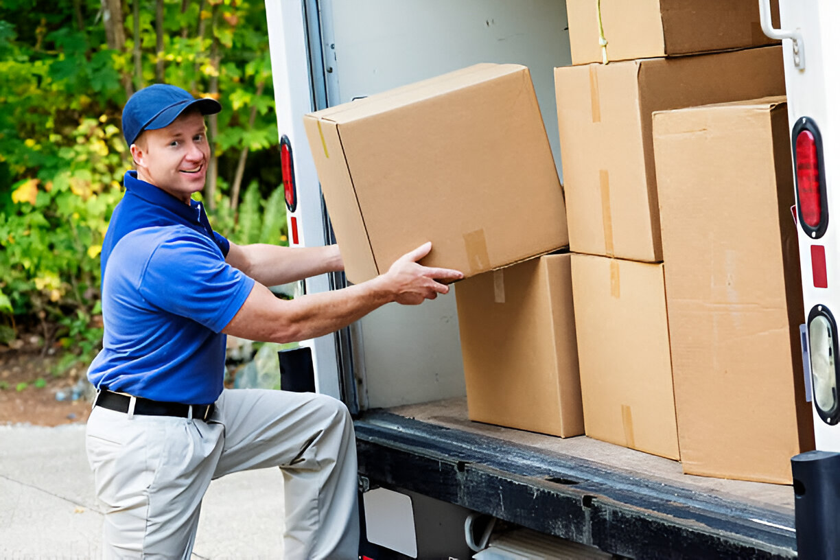 Delivery man pick boxes from the truck