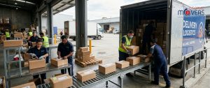 Delivery workers packing boxes for a move, avoiding common moving mistakes. Delivery workers packing boxes for a move, avoiding common moving mistakes.